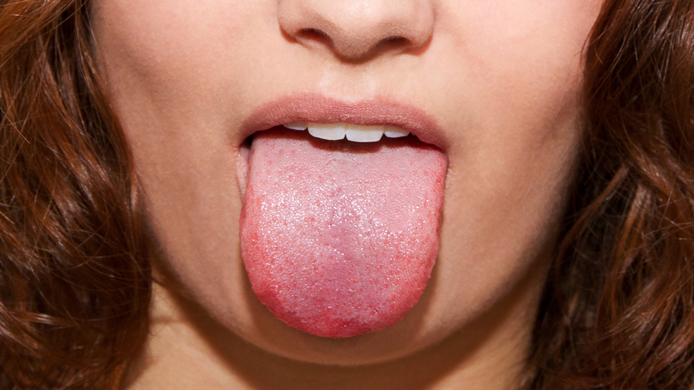 Woman with tongue extended