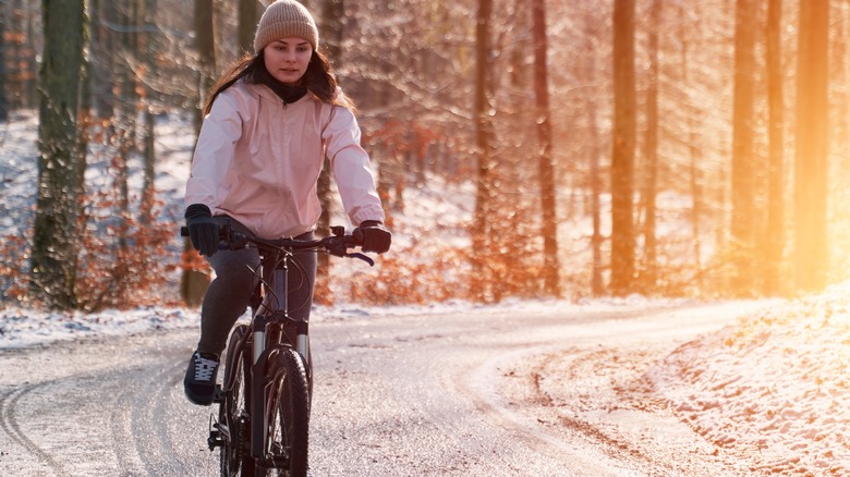 woman bike riding in snow