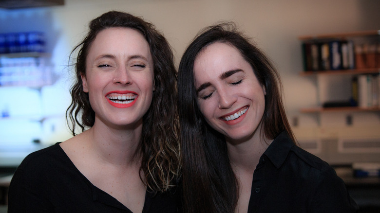 Erin Updyke (L) and Erin Welsh (R) in their lab, laughing