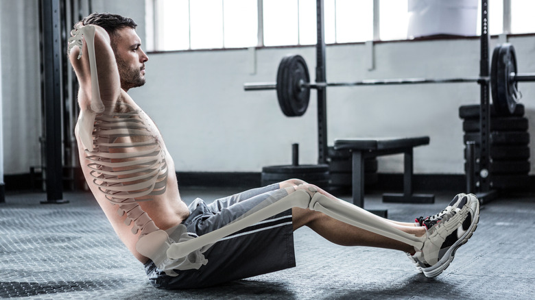 Man doing sit up with bones highlighted