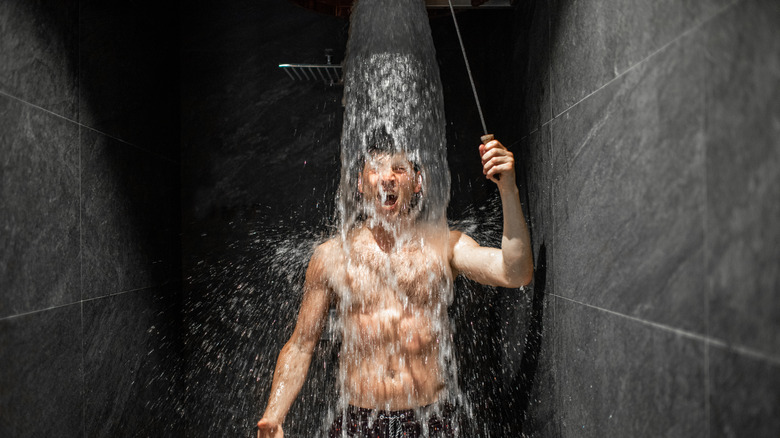 man taking cold shower