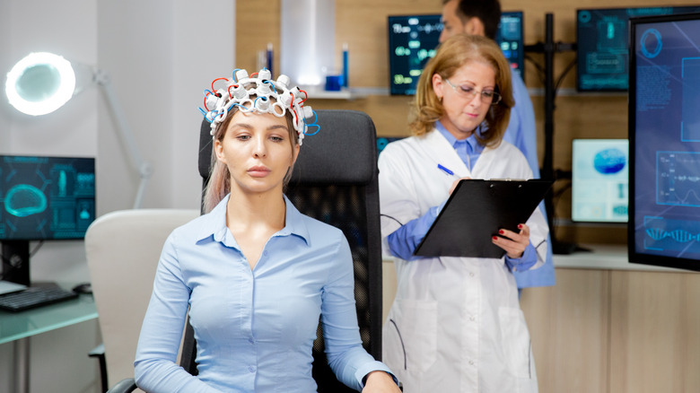 woman with sensors on her head in a sleep clinic