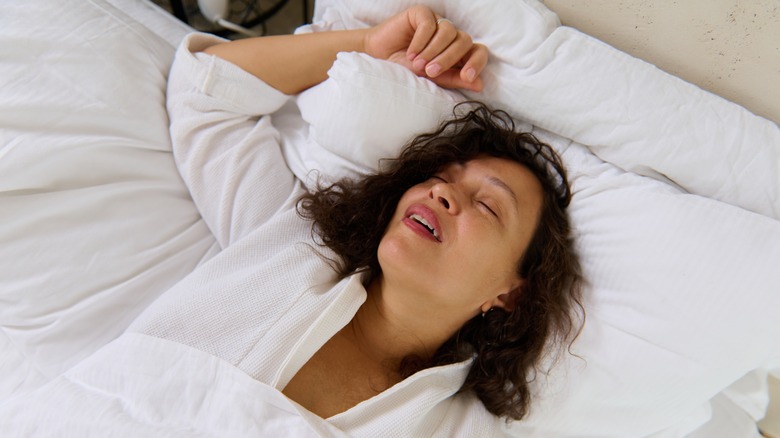 woman sleeping on her back with her mouth open