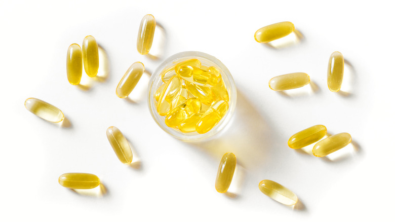 fish oil capsules on white background