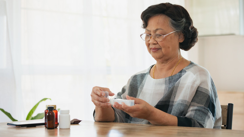 woman taking medication