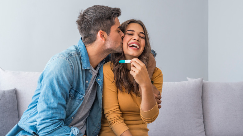 Couple seeing pregnancy test results