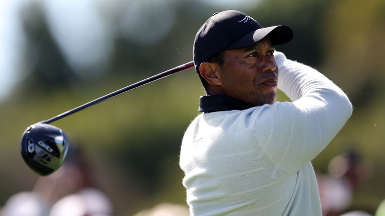 Tiger Woods swinging golf club