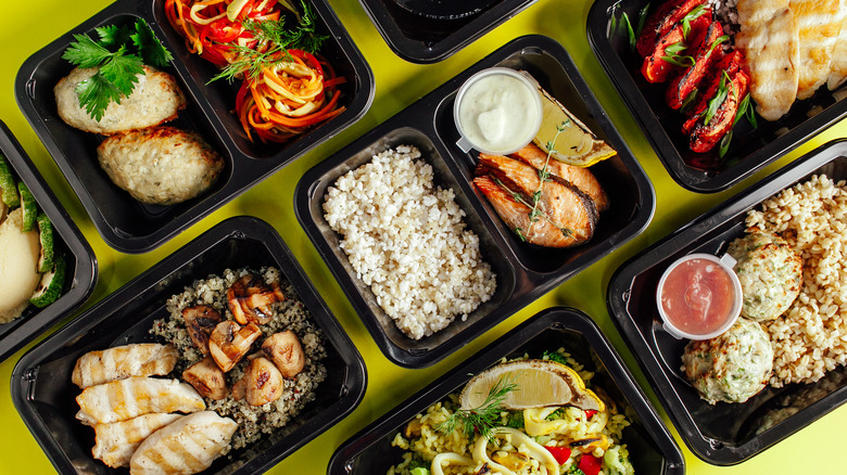 Meal prep containers with various meals