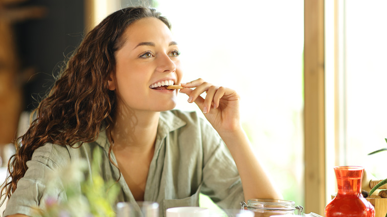 woman eating cookie