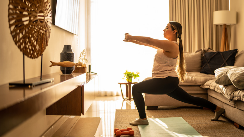 Woman stretching at home