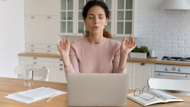 Woman practices breathing exercise