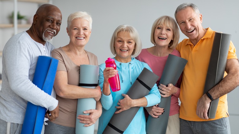 People with yoga mats