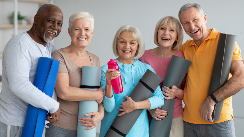 People with yoga mats