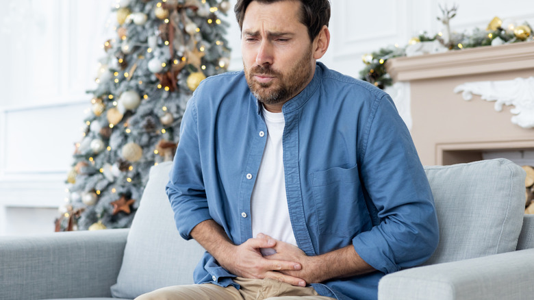 man with stomach ache during the holidays