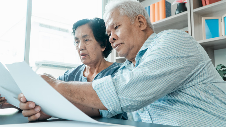 couple looking at paperwork