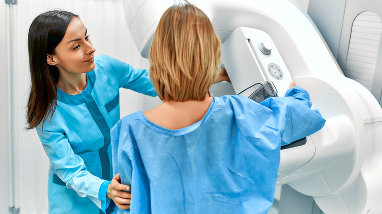 Woman having a mammogram with technologist