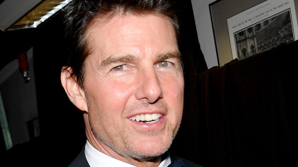 Actor Tom Cruise grinning at the camera 