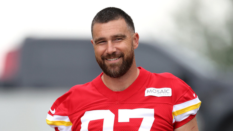 Travis Kelce smiling in his football jersey