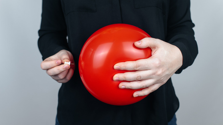 Red balloon, symbolizing a bloated tummy