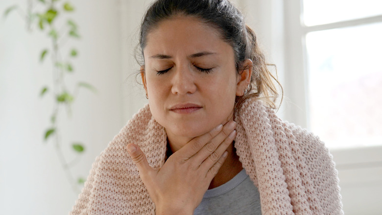 woman with sore throat