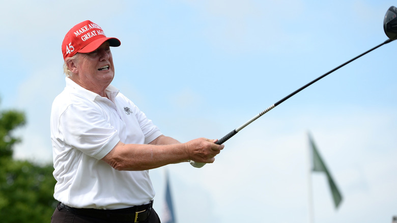 Donald Trump swinging a golf club