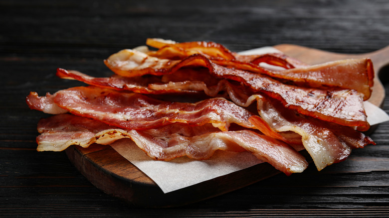 Bacon on wooden plate