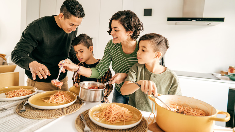 family plating pasta