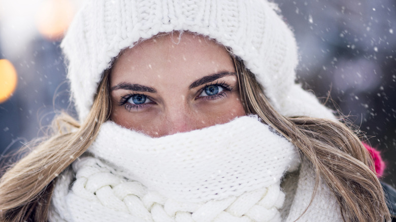 Woman's eyes in winter snow