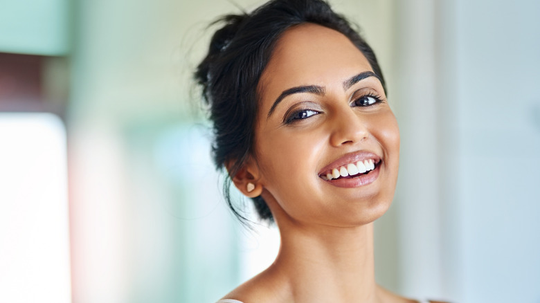 woman with beautiful skin smiling