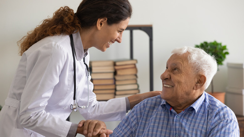 Man with nurse at home