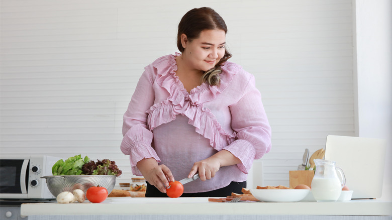 a woman making a salad