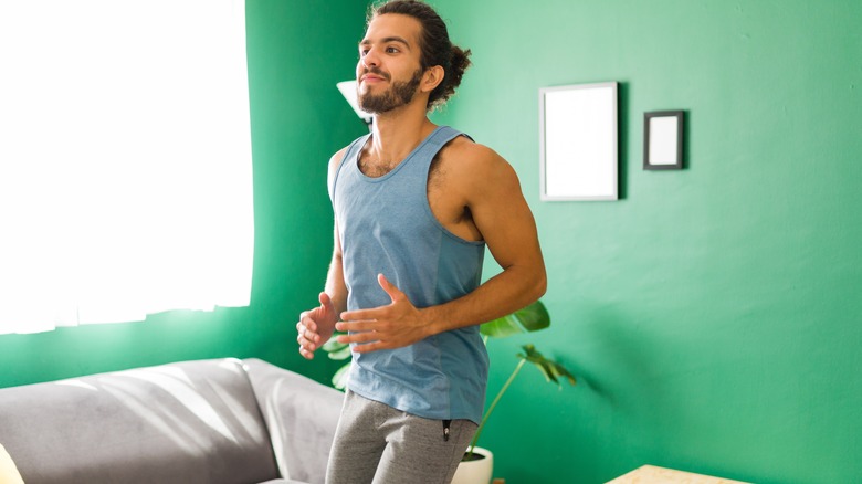 Man in tank top running