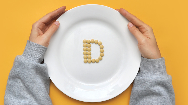 Vitamin D spelled out with pills