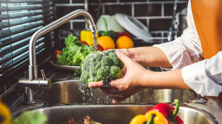 washing head of broccoli