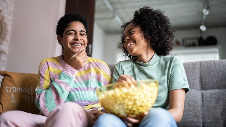 two women popcorn bowl