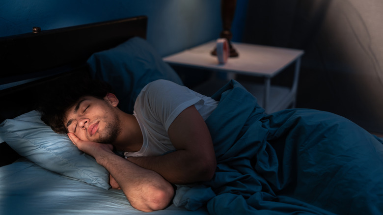 Man sleeping in bed