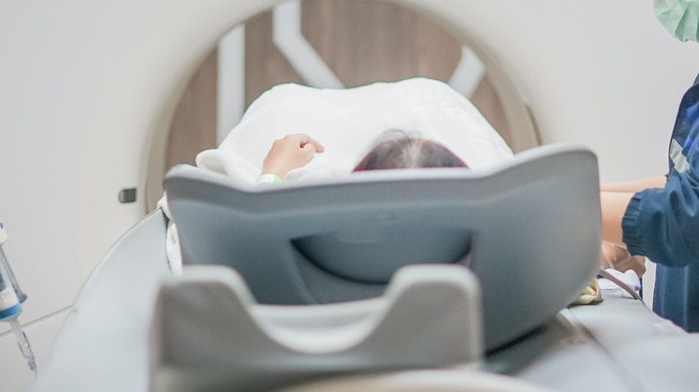 patient entering CT scanner
