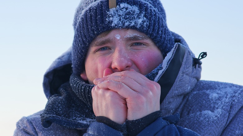 man wearing blue hat and winter coat