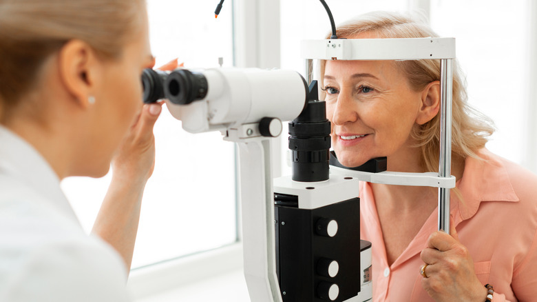 Older blonde woman at eye doctor
