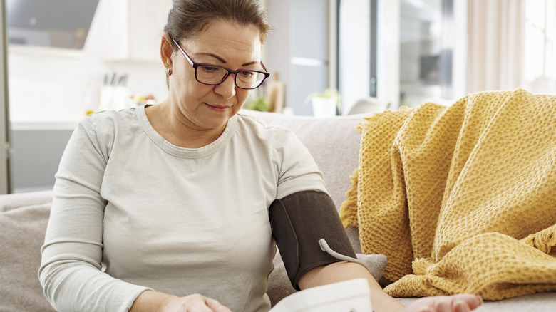 Woman checking blood pressure