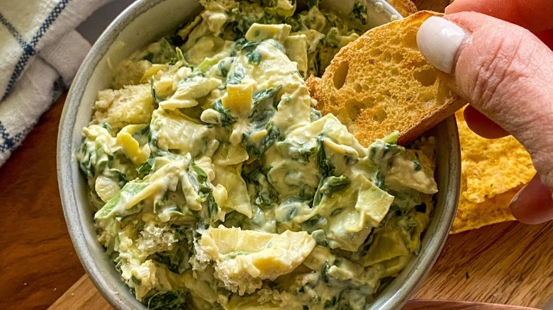 vegan spinach artichoke dip with baguette