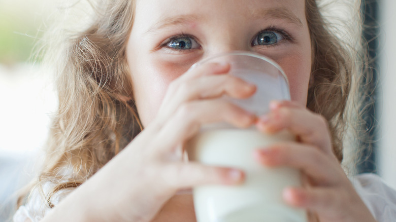 Little girl drinking milk