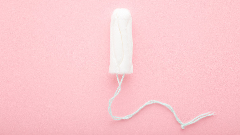 Tampon on pink background