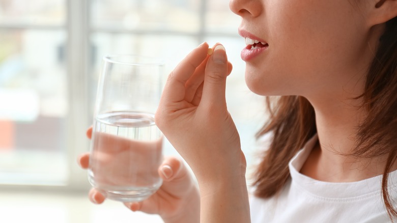 woman taking vitamins