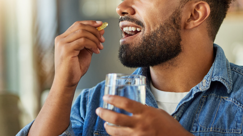 Man taking supplement