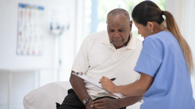 Doctor showing patient their chart