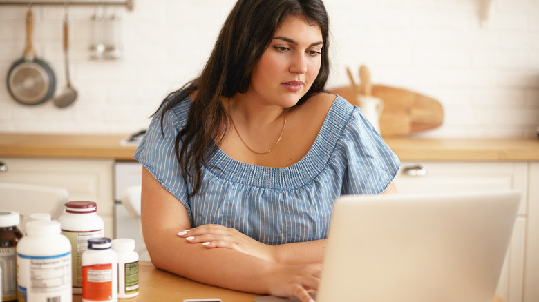 woman researching supplements