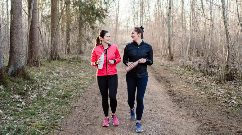 Two women walking on a hiking trail