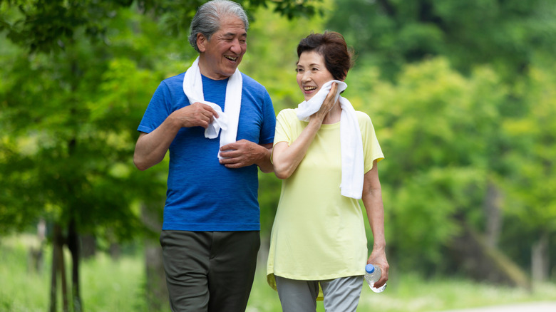 Couple walking in park