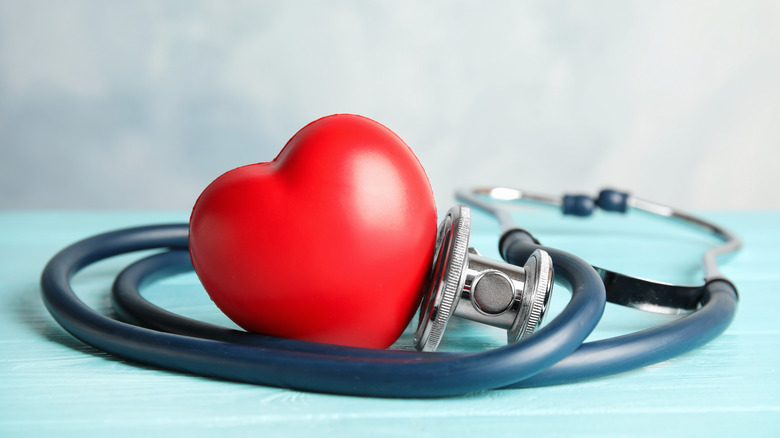 A stethoscope wrapped around a heart